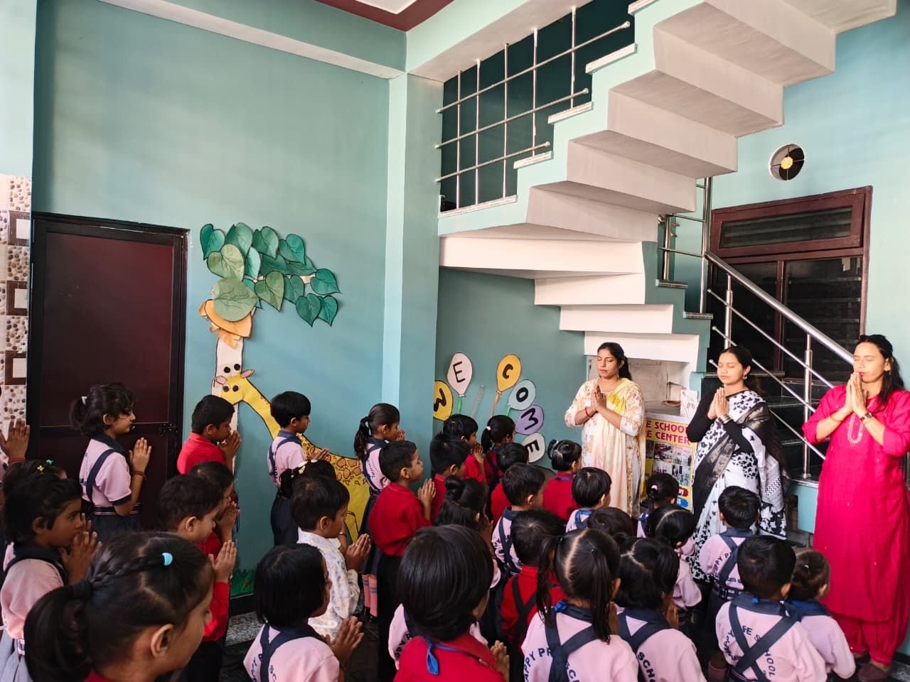 Children at morning assembly with their teachers