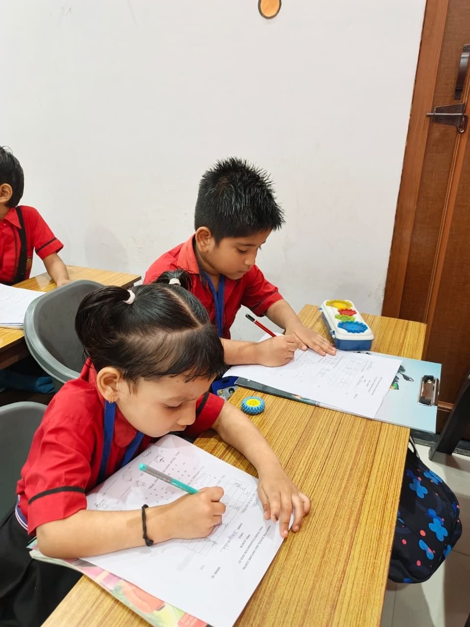 A young student carefully writing in her notebook